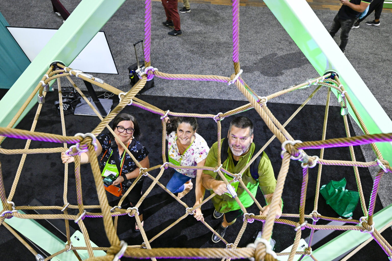 NRPA Conference attendees explore playground equipment in exhibit hall
