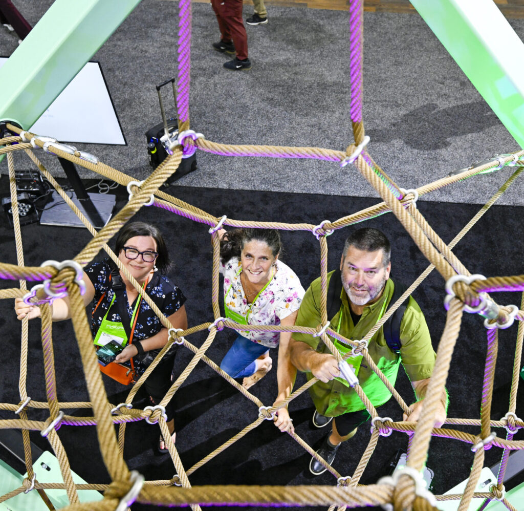 NRPA Conference attendees explore playground equipment in exhibit hall