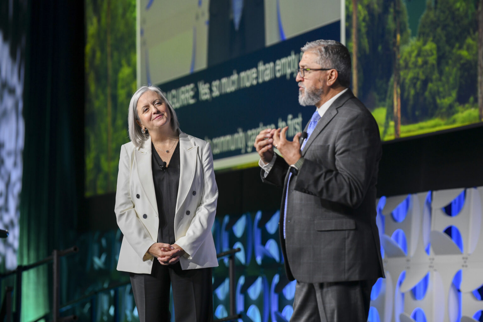 Opening General Session Day 1 Speakers stand on stage