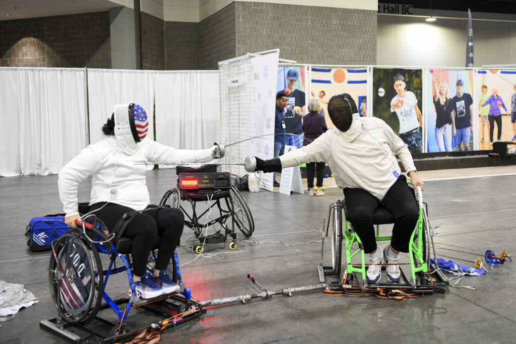 Conference attendees participate in fencing